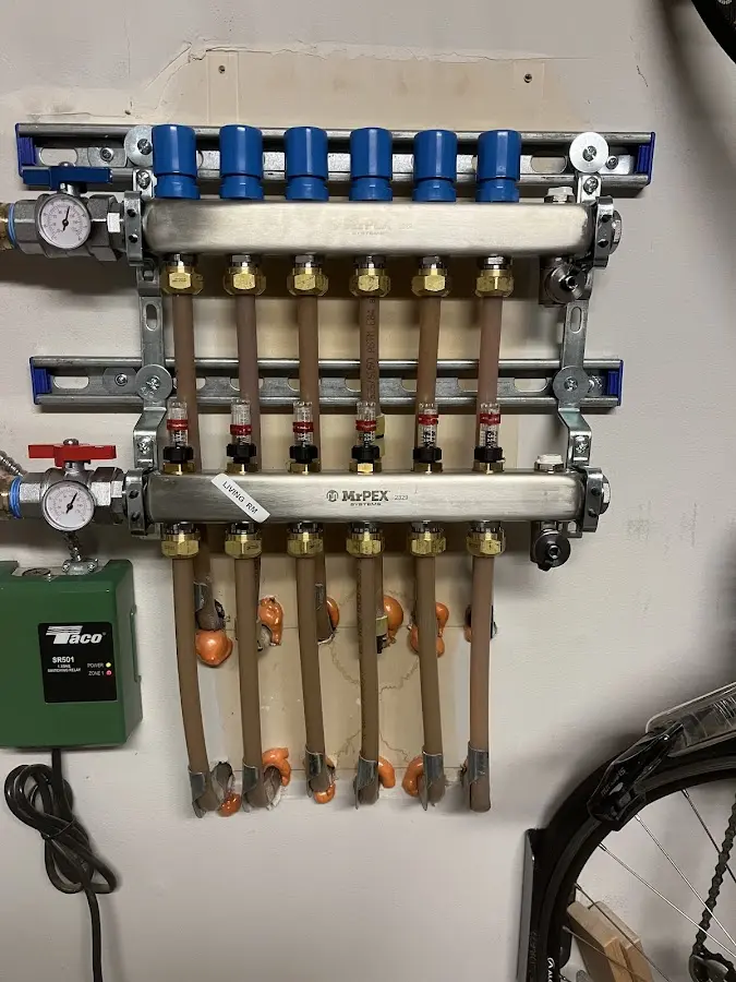 Plumber performing Water Heater Repair at a residential property in Oak Point